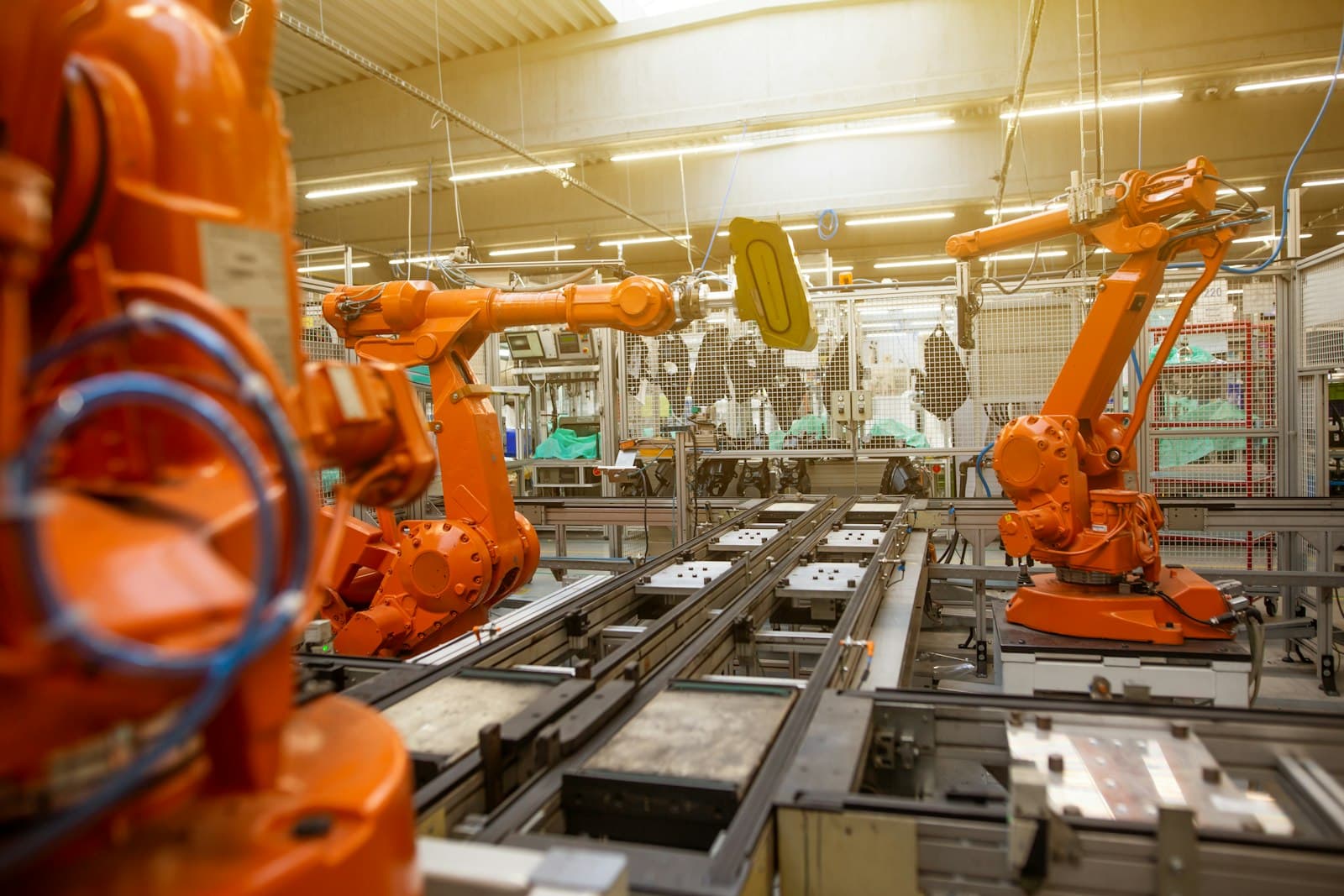 Robotic arms operating on an automated production line in a factory